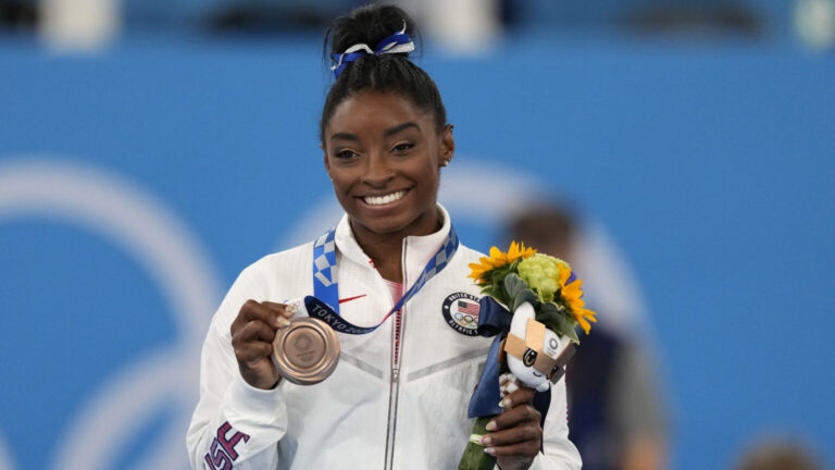 simone biles leaps into history as 1st american gymnast to overcome olympic gold in vault competition